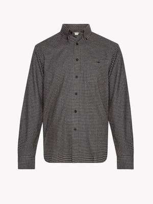 The RM Williams Collins Shirt is a long-sleeved, button-up shirt with a black and white check pattern. Made from soft brushed cotton, it features a collar and buttoned cuffs, shown against a plain white background.