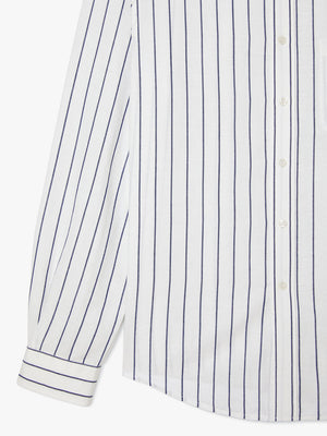 A close-up of the RM Williams Collins Shirt—a stylish, comfortable linen and tencel lyocell blend with vertical navy pinstripes, white buttons, front pocket, and cuffed sleeves.