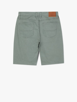 RM Williams Nicholson Short in green cotton features back pockets, belt loops, and a brown leather patch on the waistband, displayed on a white background.