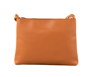 The Rusty Willow Sidebag is a compact, rectangular, light brown crossbody with a simple design and zipper closure, displayed on a plain white background.