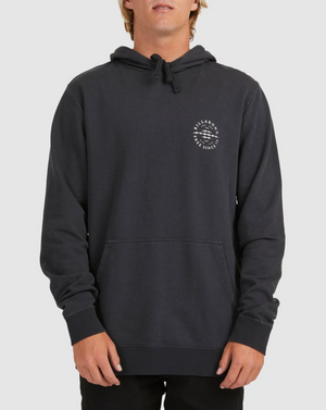 A person models the Billabong Big Wave Dan Hood, a black hoodie with a small white circular logo on the left chest, fleece lining, front pockets, and drawstrings, standing against a plain light background.