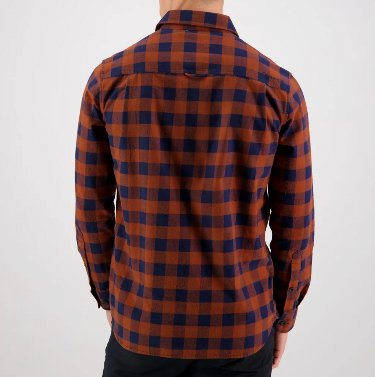 A man wearing the comfortable Swanndri Taranaki Tailor Shirt made from 100% cotton plaid fabric.