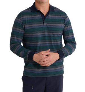 The individual, standing with hands clasped in front, is wearing a Breakaway Roe Kinnersly Jersey Polo. This long-sleeve polo shirt features blue, green, and gray horizontal stripes along with dark blue collar and cuffs. It's made from a polyester/cotton blend and includes a small chest pocket. Only the torso and part of the legs are visible.