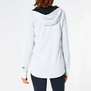 A person is seen from the back wearing a Rip Curl Anti Series Flux II Zip, highlighting its Durable Water-Resistant fabric. The hoodie has a black hood and is paired with dark leggings on a white background. The phrase "Built for Athletes" is near the lower hem, combining style with winter functionality.