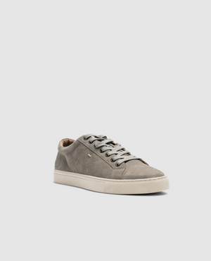 The Rodd & Gunn Endeavour Spirit Sneaker in gray nubuck leather is displayed against a plain white background. Featuring clean lines, matching gray laces, and comfortable white rubber soles, this sneaker offers a minimalistic design for a simple yet stylish appearance.