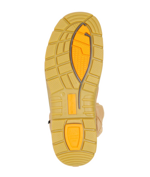 The image features the King Gee Bennu Rigger High Leg Zip Side Safety Boot's tan rubber outsole with a deep tread, a mostly yellow and orange design, visible metal support, and the "Vibram" brand embossed, emphasizing its robust functionality for tough environments.