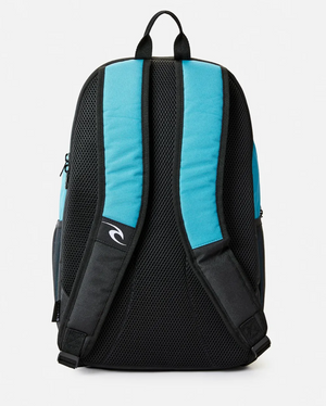 The image displays the Rip Curl Ozone 30L School Backpack, made from recycled polyester. It has padded black straps, a blue mesh back for ventilation, and a fabric loop for hanging. A small logo appears on one strap, indicating its hidden laptop compartment.