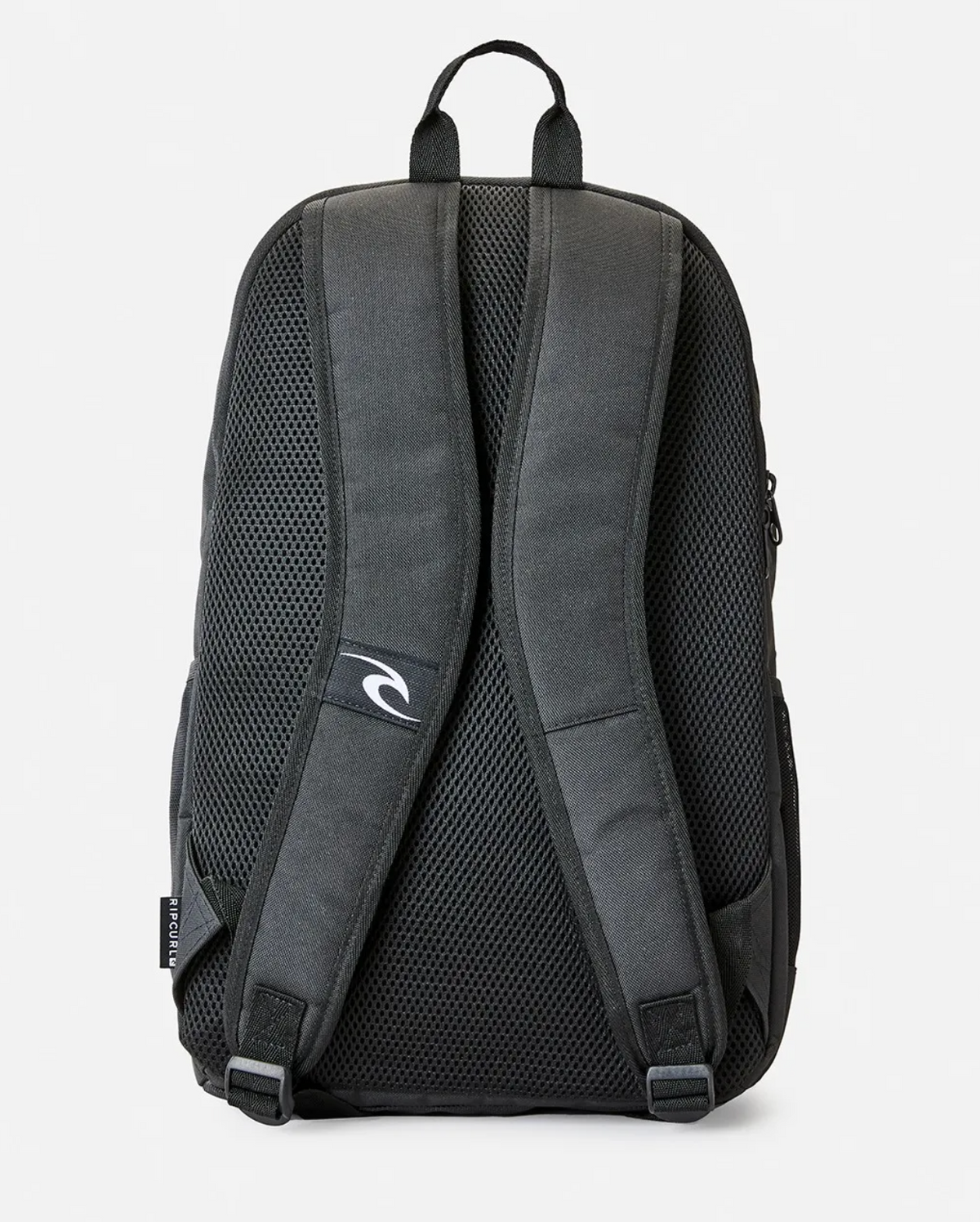 The Rip Curl Ozone 30L School Backpack is displayed from the back. It's black, made from recycled polyester and has padded shoulder straps with mesh for comfort and ventilation. A small logo is on one strap, a side pocket is partly visible, all against a plain white background.