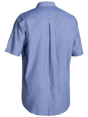 The Bisley Chambray Cotton Short Sleeve Shirt features a light blue back view with a traditional fit, collar, and central box pleat.