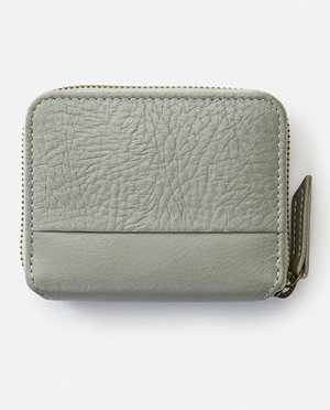 The Rip Curl Small Leather Wallet in gray leather features a textured upper and smooth lower section, an ID window, and a zip-around closure with a zipper pull on the right side against a plain white background.
