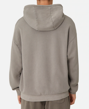 A rear view of a person wearing the oversized, comfy Industrie The Del Sur Hoodie in gray with matching pants, featuring a large hood, long sleeves, and an embroidered Industrie logo against a white backdrop.