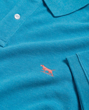 Close-up of the Rodd & Gunn The Gunn Polo, a teal modern fit shirt made from soft Australian Cotton, featuring a small embroidered red dog emblem and buttoned collar for a classic look.
