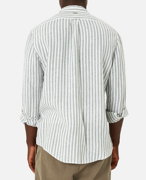 Rear view of a person wearing the Industrie The Bayshore Linen Shirt, a comfortable light gray and white striped long-sleeve made from 100% linen, with rolled-up cuffs and button-down design, paired with khaki pants against a plain white background.