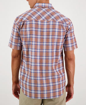 A person is seen from behind in a short-sleeved Swanndri Kennedy Point Shirt, featuring brown and blue plaid, a cotton-linen blend with collar and buttons. They wear light-colored pants against a plain white background, highlighting the shirt's tailored fit.