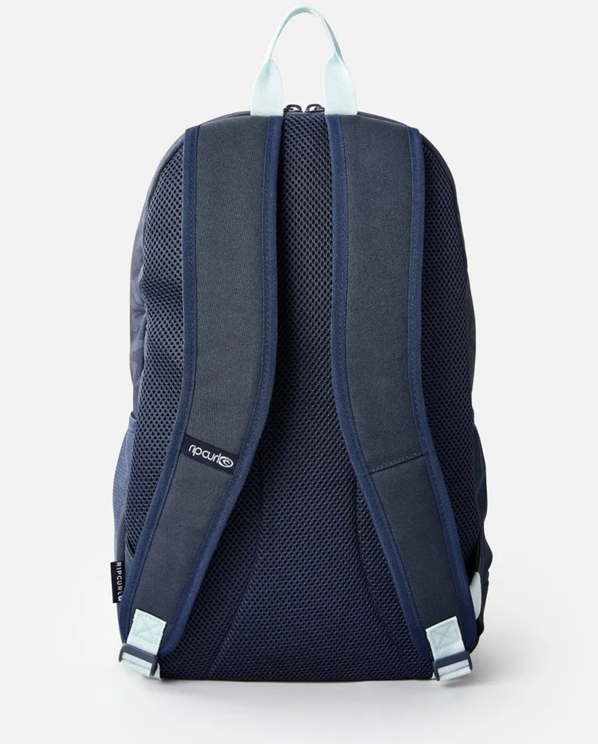 The Rip Curl Heat Wave Ozone 30L Backpack in navy blue, with light blue handles and straps, is shown from the back. It has two adjustable straps, breathable mesh fabric, and is crafted from recycled polyester with a visible logo on the strap for an eco-friendly and stylish design.