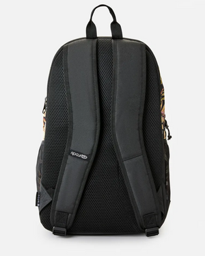 Back view of the black Rip Curl Ozone 2.0 30L Backpack, crafted from recycled polyester, features padded shoulder straps, mesh padding, top handle, adjustable straps, laptop compatibility, side pockets, and a small logo tag enhancing its side printed design.