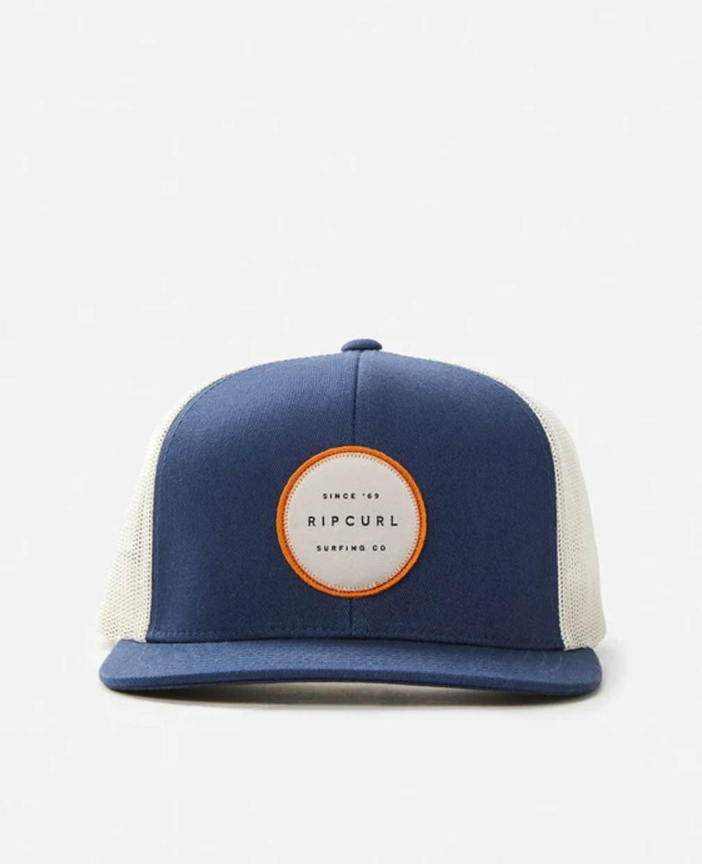 Rip Curl Routine Trucker Cap in blue and white features a front patch saying "Rip Curl Surfing Co." It has a solid blue front and brim, white mesh back, and an adjustable strap for ideal fit.