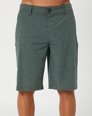 A person wears dark green, knee-length Rip Curl Boardwalk Phase Shorts with a button and zip closure against a plain light background. Made from quick-dry, water-repellent fabric, they're ideal for any adventure.