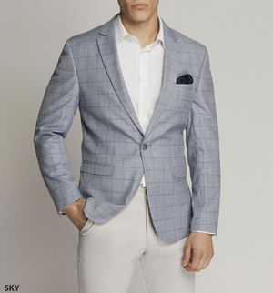 A person in a Scuzzatti Check Slim Fit Sports Jacket, light gray with a checkered pattern, paired with a white shirt and beige pants. A black pocket square is neatly tucked into the blazer's breast pocket, showcasing precise styling against the plain light gray backdrop.