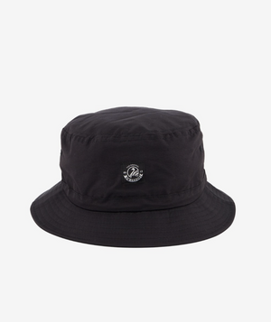 Introducing the Swanndri Murrays Bay v2 Hat— a black bucket hat featuring a small embroidered circular logo with text and design on the front. It has a flat top, downward-sloping brim, and visible seam stitching. Perfect for any occasion against a plain white background.
