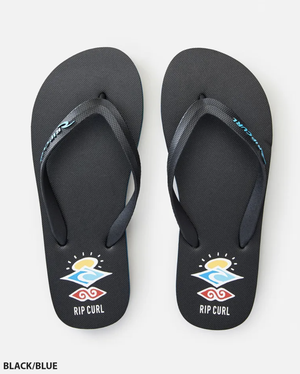 A pair of Rip Curl Icons Thongs in black, with ergonomic blue straps featuring a swirling wave design and "RIP CURL" on the premium EVA rubber footbed, set against a plain white background.