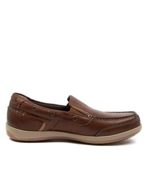 The Colorado Broad Slip On Boat Shoe features a side view of brown leather with stitching details, memory foam footbed, slightly raised beige sole, eyelet accents, and moccasin-style toe for comfort and style.
