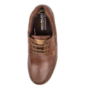 The Colorado Brace Boat Shoe is a brown leather shoe with visible stitching, a lace-up design, and a textured slip-resistant sole. It includes the brand name on the inner sole and features a memory foam footbed for classic, casual style suitable for everyday wear.