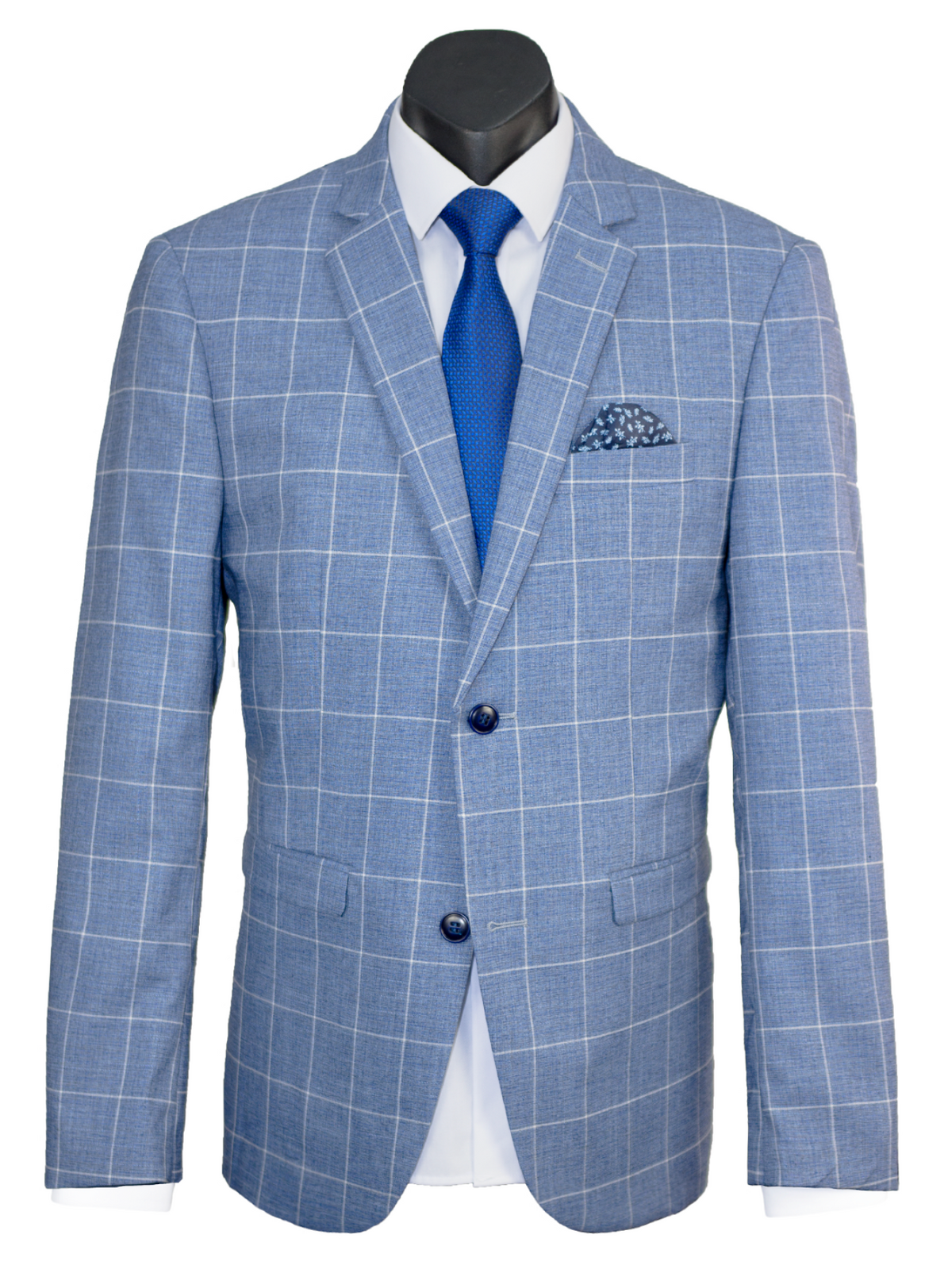The Scuzzatti Check Suit features a slim fit wool blend jacket with a blue checkered pattern, paired seamlessly with a white dress shirt and blue tie. It has white grid lines, a stylish blue polka dot pocket square, and is fastened with two buttons.