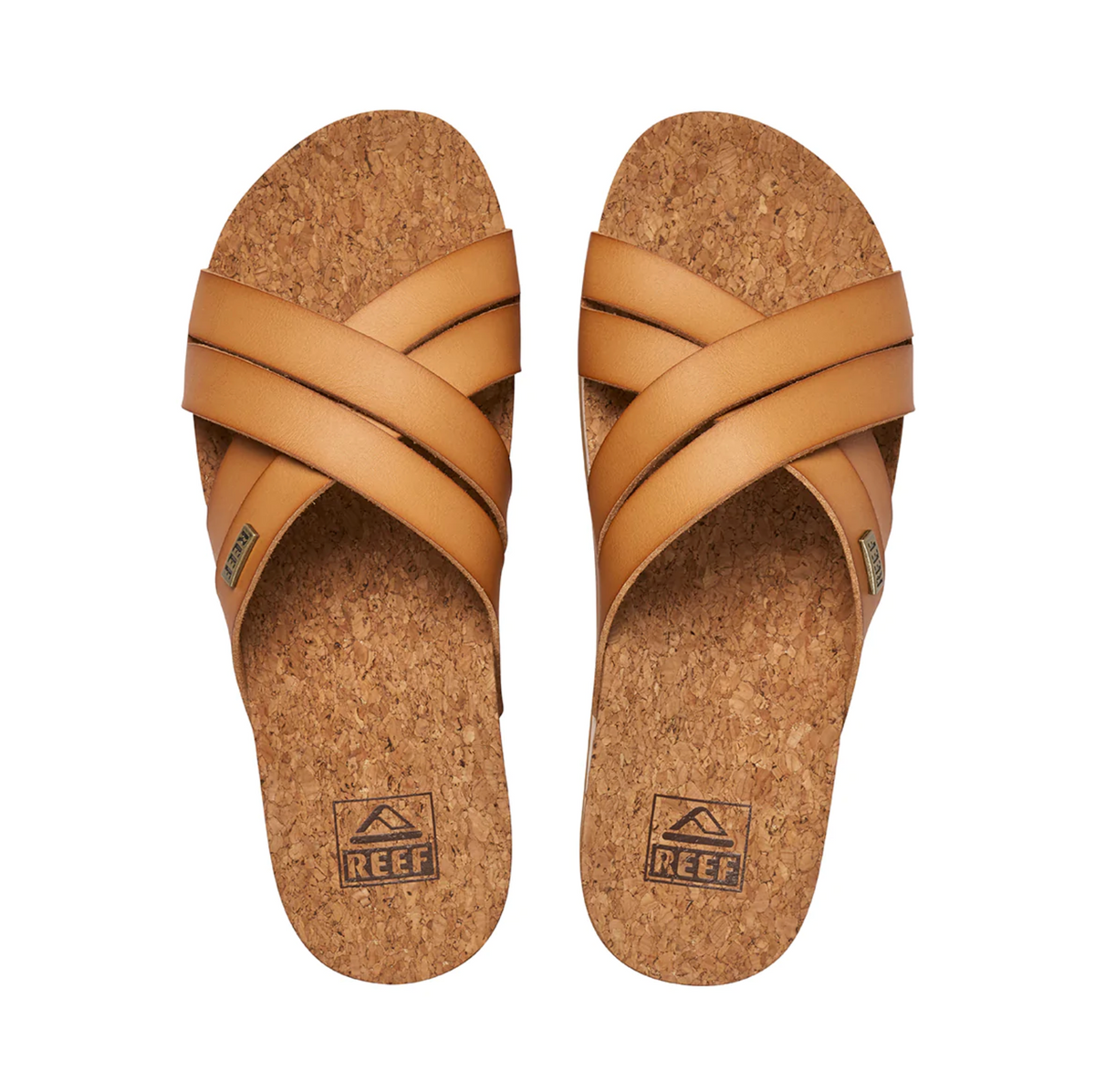 The REEF Cushion Bloom Hi sandals feature tan leather straps and a stylish cork-patterned footbed. With "REEF" printed near the heel, they provide ultimate comfort with a cushion bounce midsole.
