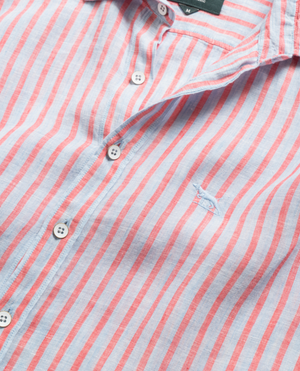 A close-up of the Rodd & Gunn Mclean Park Oxford Sports Fit Shirt, featuring vertical pink and white stripes, white buttons, sports fit, and a small embroidered blue whale logo on the chest.