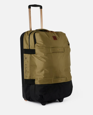 The Rip Curl F-Light Global 110L Overland Travel Bag, crafted from recycled polyester in khaki and black, features a retractable handle, side handles, a front zipper pocket, and wheels for easy transport. Its sturdy design and 110L capacity make your journeys smooth and stylish.