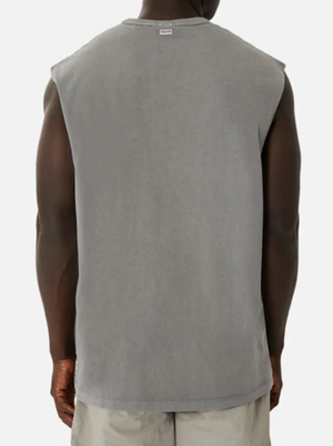 Rear view of a person wearing an oversized Industrie The Del Sur Sleeveless Tee in gray and light-colored shorts, set against a plain white backdrop.