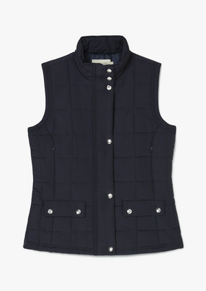 The RM Williams Wilpena Creek Vest is a sleeveless, navy blue quilted vest with a high collar and snap button closure, featuring two front flap pockets with snap buttons and a subtle logo on the left chest.