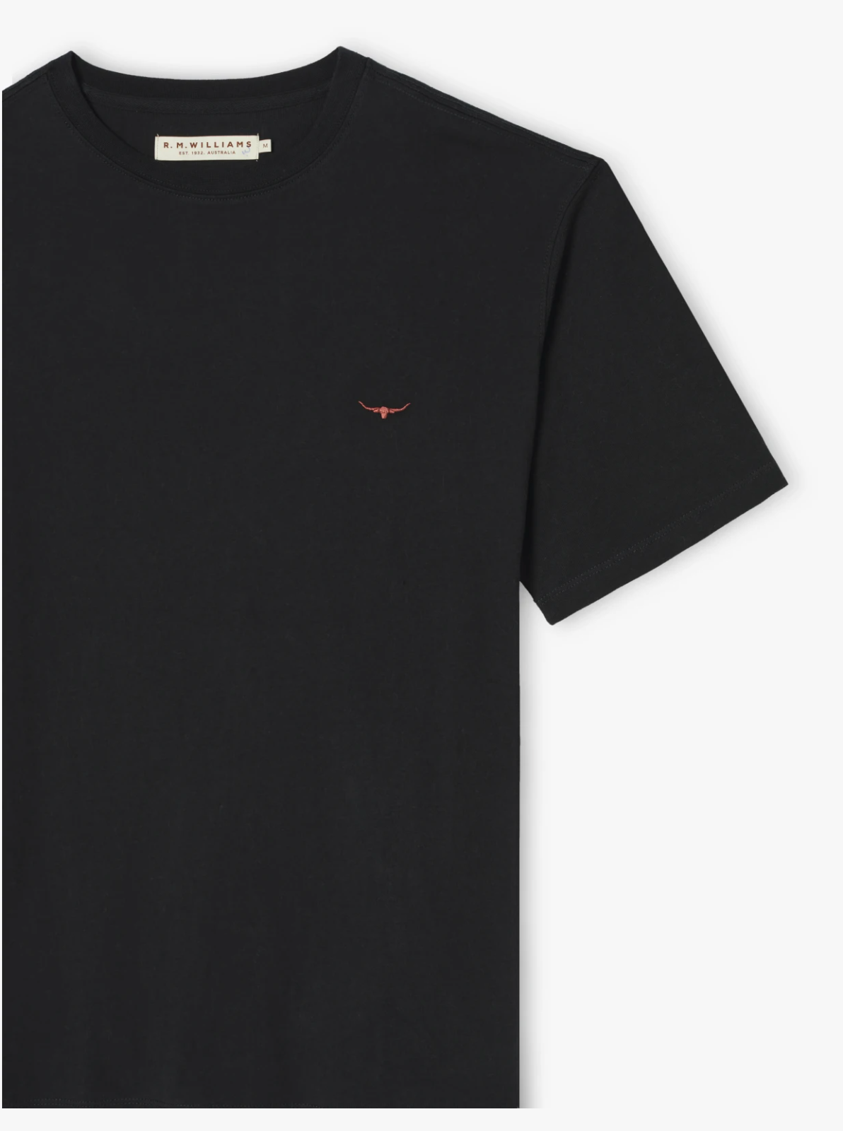The RM Williams Parson T-Shirt is a classic piece in black, showcasing a small embroidered red bull symbol on the left side of the chest. Crafted from pure cotton jersey, it features a crew neck and short sleeves. The label inside the collar reads "R.M. Williams.