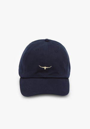 Introducing the RM Williams Mini Longhorn Cap: A navy blue classic twill cap adorned with a small embroidered longhorn skull logo in white on the front. This stylish baseball cap features a curved brim and a top button, set against a crisp white background.
