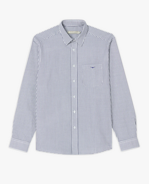 The RM Williams Collins Shirt is a classic-fitting, long-sleeved button-up dress shirt made from twill cotton. It boasts a small checkered pattern in blue and white, with a front pocket featuring an embroidered logo, all set against a white background.