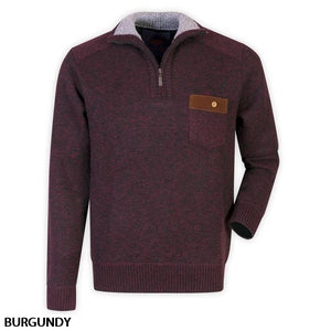 The Sugar Zip Neck Sherpa Lined Knit is a comfortable jumper in burgundy, featuring a mock neck and a brown buttoned front pocket. The quarter-zip extends halfway down from the neckline, and the cuffs, hem, and collar are ribbed. "BURGUNDY" is written in black text at the bottom left of the image.