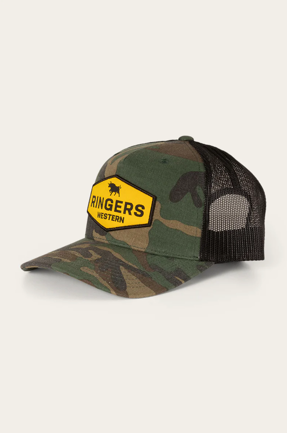 The Ringers Western Scotty Trucker Cap boasts a camo design with a black mesh back and a yellow patch featuring the brand's bull silhouette. Made from durable cotton twill, it offers both rugged style and everyday comfort.
