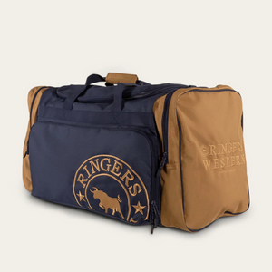A Ringers Western Rider Sports Bag in navy blue and tan, featuring "Ringers Western" and a bull logo printed on the front pocket. The sports bag includes dual handles, a side pocket, and a zippered main compartment.