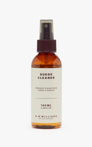 A bottle of RM Williams Suede Cleaner Spray features the label: "Suede Cleaner, removes stains from suede & nubuck." The product volume is showcased as "100 ML (3.3 FL. OZ)" and the non-abrasive cleaner is branded at the bottom as: "R.M. Williams Est. 1932, Australia.