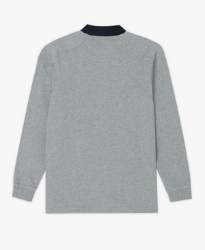 The RM Williams Classic RMW Rugby, a grey long-sleeve polo shirt reminiscent of traditional rugby attire with a dark collar, is displayed flat to reveal its back side. Crafted from heavy cotton jersey, this uncomplicated and relaxed design ensures comfort.