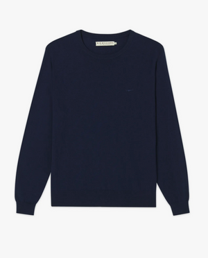 An RM Williams Howe Sweater in navy blue Merino wool is neatly positioned against a white background. The sweater features a subtle Longhorn embroidery near the chest area and has ribbed cuffs and hem.