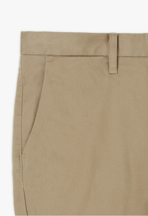 Close-up of a pair of RM Williams Stirling Chino pants in beige stretch cotton, showcasing the right-hand front pocket, waistband with a belt loop, and part of the zipper area. The smooth, lightweight fabric ensures comfort while maintaining a classic look.
