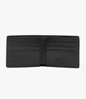 An open black RM Williams City Slim Bi-Fold Wallet is displayed, showcasing multiple card slots. Made from full grain leather, the inside lining bears the embossed signature logo of "R.M. Williams." The wallet is empty, revealing its neat and organized compartments.