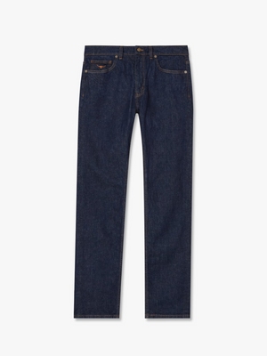 The RM Williams Ramco Jean is a pair of dark blue denim jeans with a straight leg cut and regular fit. Made in Australia from premium denim, these jeans feature a classic button and zip closure, belt loops, and five pockets—two front pockets, two back pockets, and a small coin pocket on the right front side.