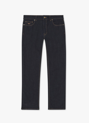 The RM Williams Ramco Jean is a pair of dark blue, premium denim straight leg jeans with a classic fit. Featuring a button and zipper fly, five pockets (including a coin pocket), and contrast stitching, these jeans adhere to a timeless design.