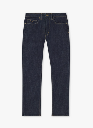 The RM Williams Ramco Jeans are dark blue denim with a classic straight-leg design. These 5-pocket jeans feature yellow stitching, front and back pockets, belt loops, and a button-zipper fly closure. The fabric is thick and durable.