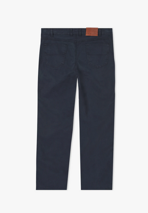 A pair of RM Williams Linesman Cotton Jeans displayed in navy blue from the back. Made in Australia, these slim fit jeans feature two back pockets and a brown leather label on the waistband.