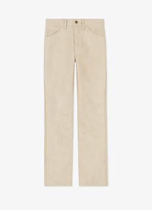 The RM Williams Cleanskin Moleskin Jean is a pair of beige, straight-leg trousers with a button and zipper closure, featuring two front pockets and two back pockets, showcased on a white background. Drawing inspiration from Australian stockmen jeans, they provide both style and durability.