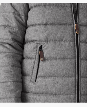 A close-up of the RM Williams Patterson Creek Jacket showcases its quilted gray design with horizontal stitching. It features a partially visible vertical main zipper, a zippered side pocket with a brown leather pull tab, and is crafted from soft, insulated, durable polyester twill.